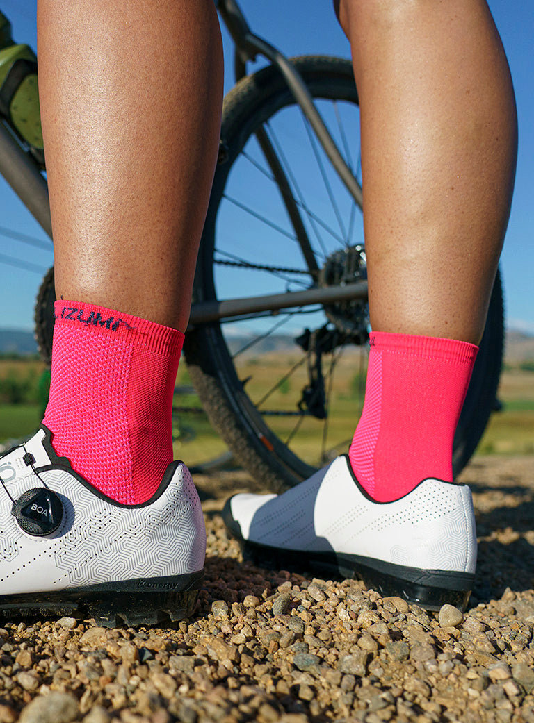 Gravel Cyclist With Pink Socks and White Shoes from PEARL iZUMi