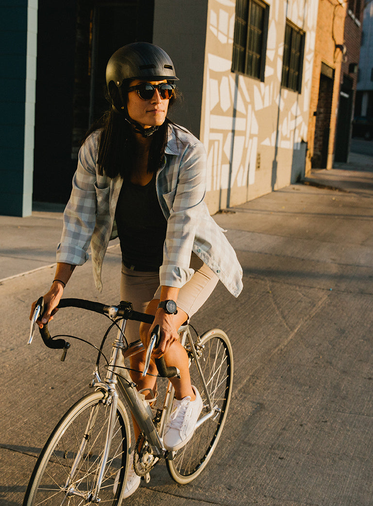 Urban Cyclist Riding Down City Street