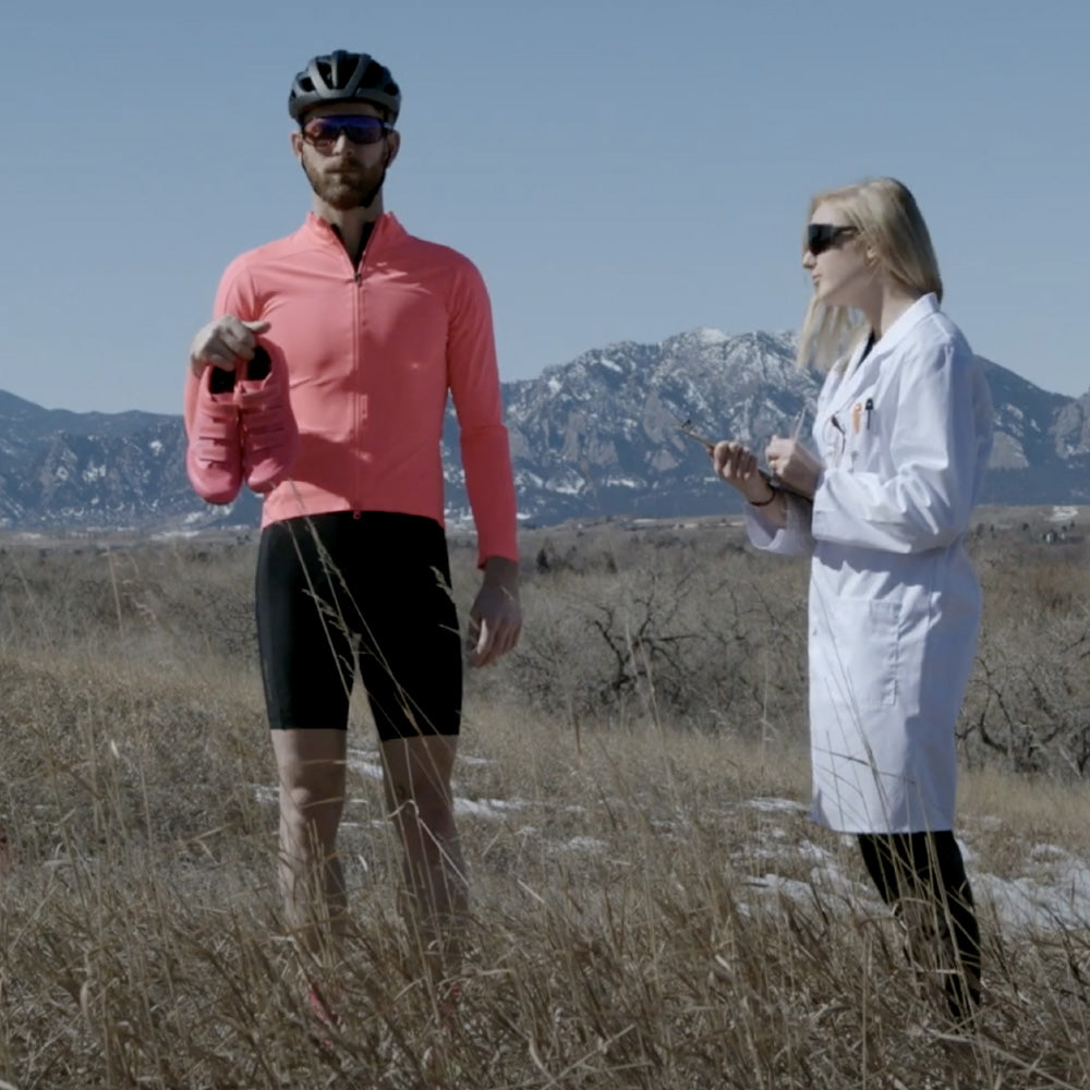 Cyclist and Scientist Standing in a Field