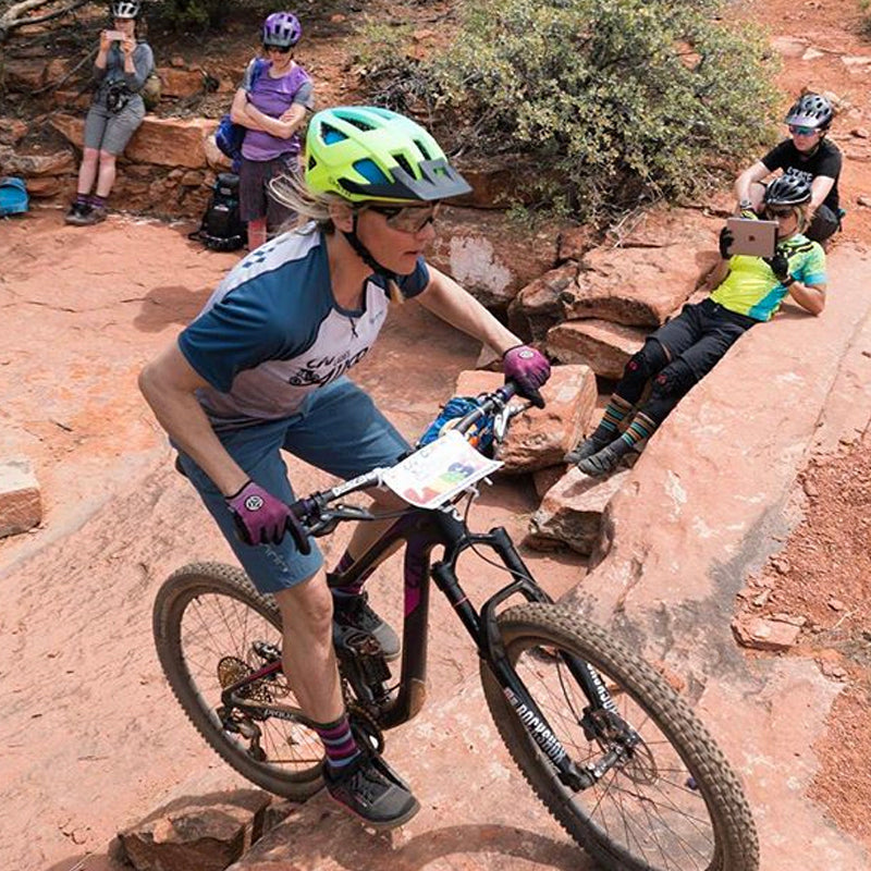 Mountain Biker Climbing Up a Trail In the Desert