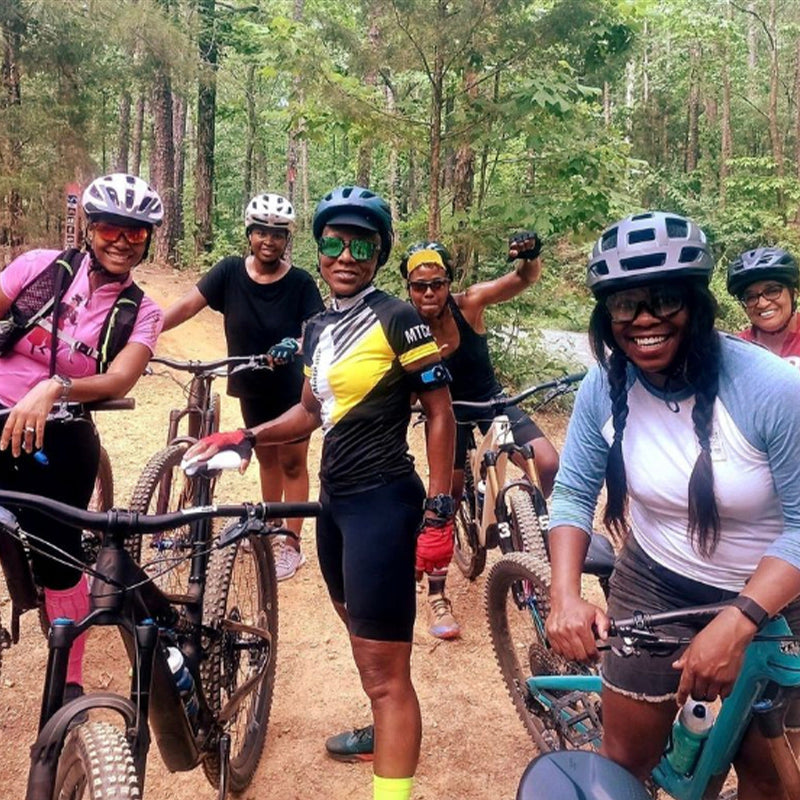 Mountain Bike Riders Posing Together After a Day of Riding