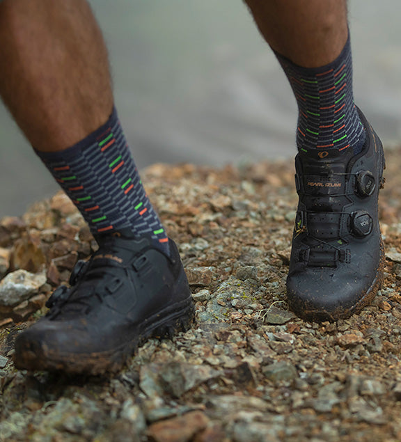 Mountain Biker Wearing Blue PEARL iZUMi Socks