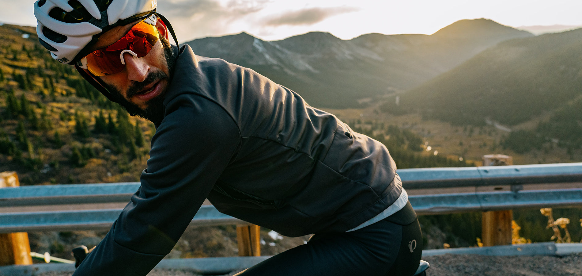 Road Cyclist Looking Behind Him on a Climb Through The Mountains