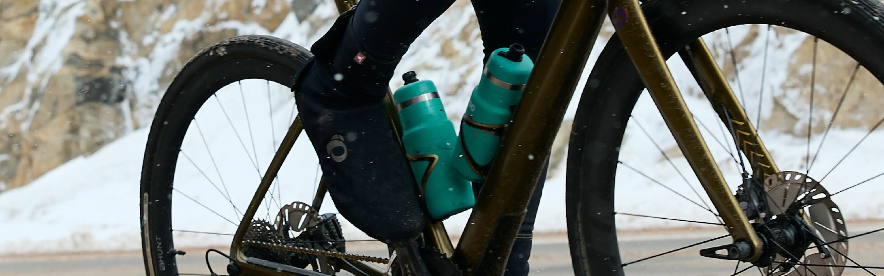 Rider Wearing Cycling Shoe Covers on Muddy Terrain