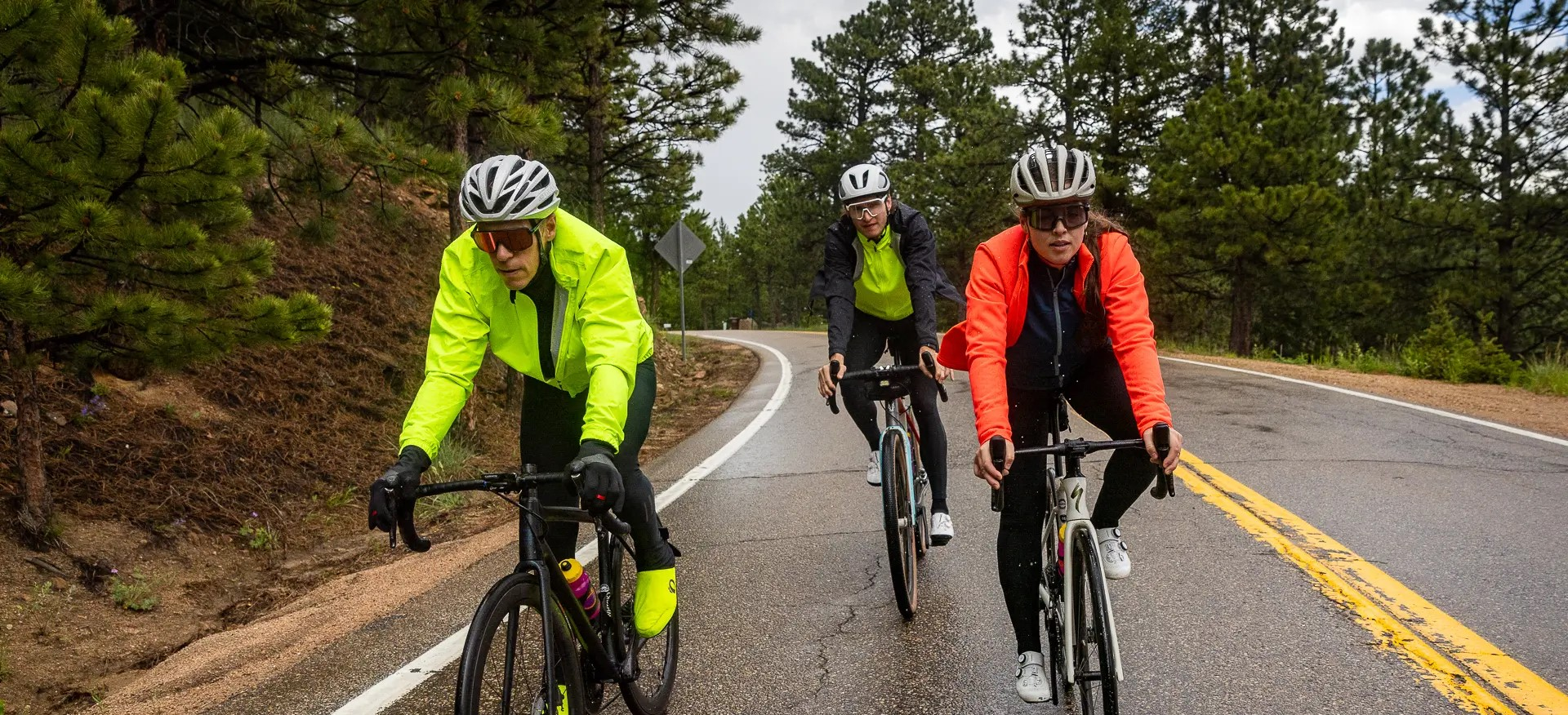Group of road cyclist riding in the cool, wet weather wearing PEARL iZUMi outerwear