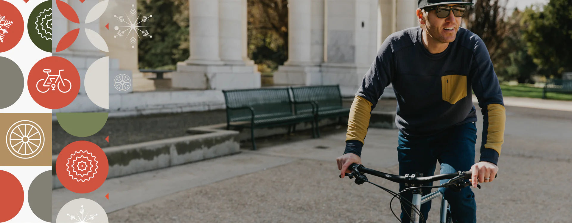 Male cyclist carrying his bike after a commute to work while wearing PEARL iZUMi BileStyle apparel