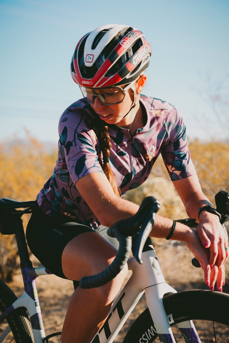 Woman siting on a road bike in PEARL iZUMi kit