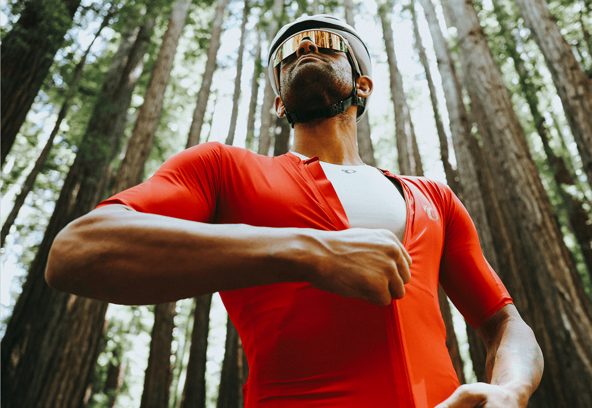 Cyclist in red jersey getting ready for a ride.