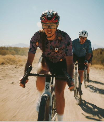 Woman riding gravel in PEARL iZUMi apparel