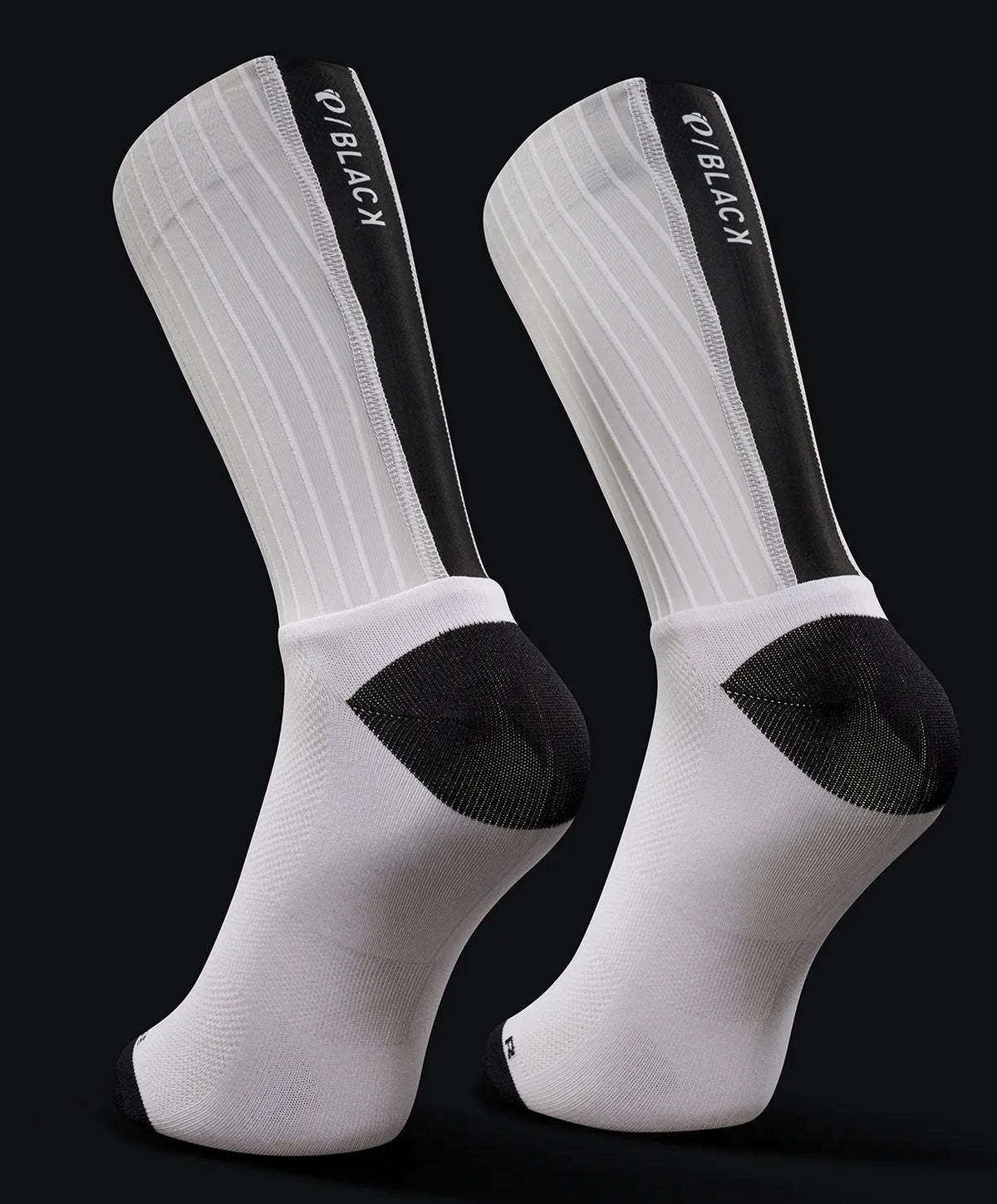 White knee-high socks with black accents and visible branding on a black background
